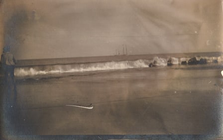 RPPC Real Photo Postcard showing a person on Santa Barbara Beach with a sailing ship at sea c. 1910s