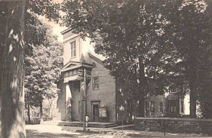 Postcard showing the Presbyterian Sunday School building on a tree-lined street in Hackettstown, NJ.