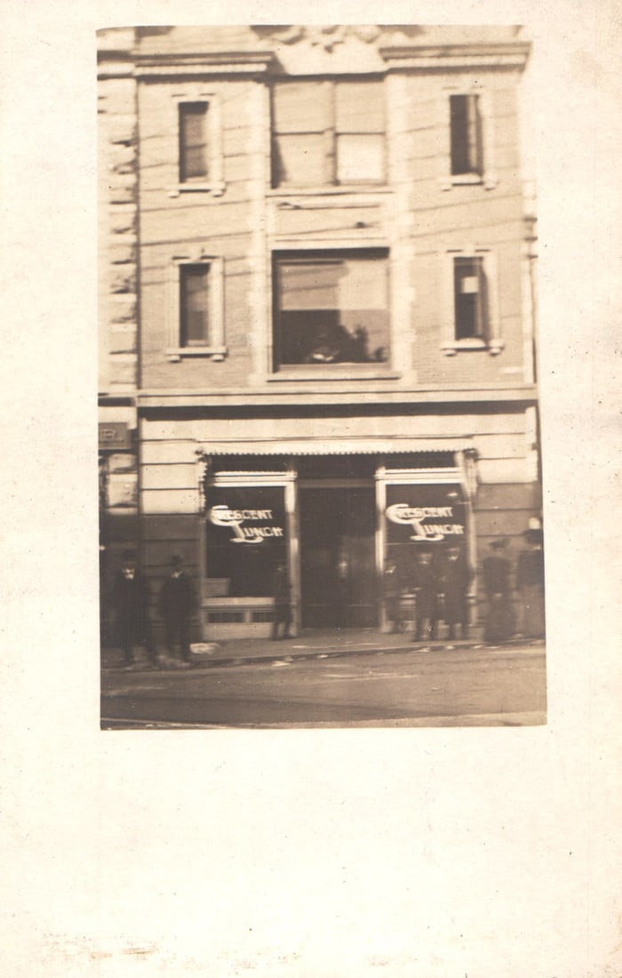 RPPC Real Photo Postcard showing the Crescent Lunch storefront with men on sidewalk. Undivided back: Please view photos for further description and condition considerations. Please know the scans may be darker or lighter than the actual item's true appearance. ACME Auctions offers FREE DOMESTIC SHIPP