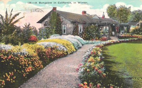 Postcard depicting a lovely California bungalow and its lush garden path during winter, c. 1920s.