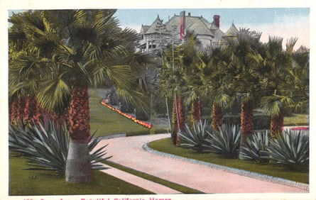 Postcard showing a beautiful California home with lush palm trees and garden pathway, Los Angeles c.