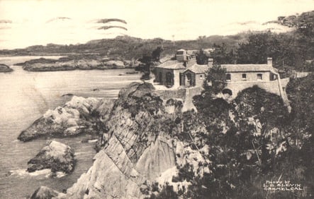Postcard view of a Carmel Highlands Residence on the scenic rocky coastline of Carmel, California.