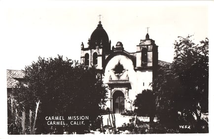 Real Photo Postcard showing the facade and bell towers of the Carmel Mission in Carmel, California