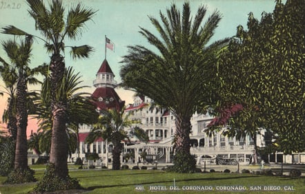 Postcard view of the famous Hotel Del Coronado framed by palm trees, San Diego, California c. 1915.