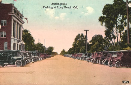 Postcard showing rows of early automobiles parked on a street in Long Beach, California circa 1914