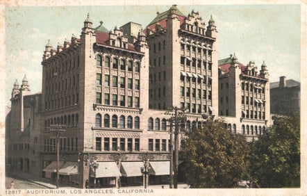 Postcard showing the grand Auditorium building on a street corner in Los Angeles, California c.