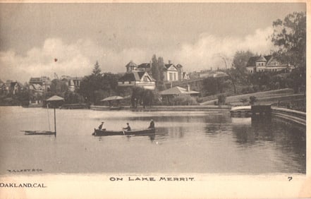 Postcard view of canoers on Lake Merritt with shoreline residences, Oakland, California, c. 1905.
