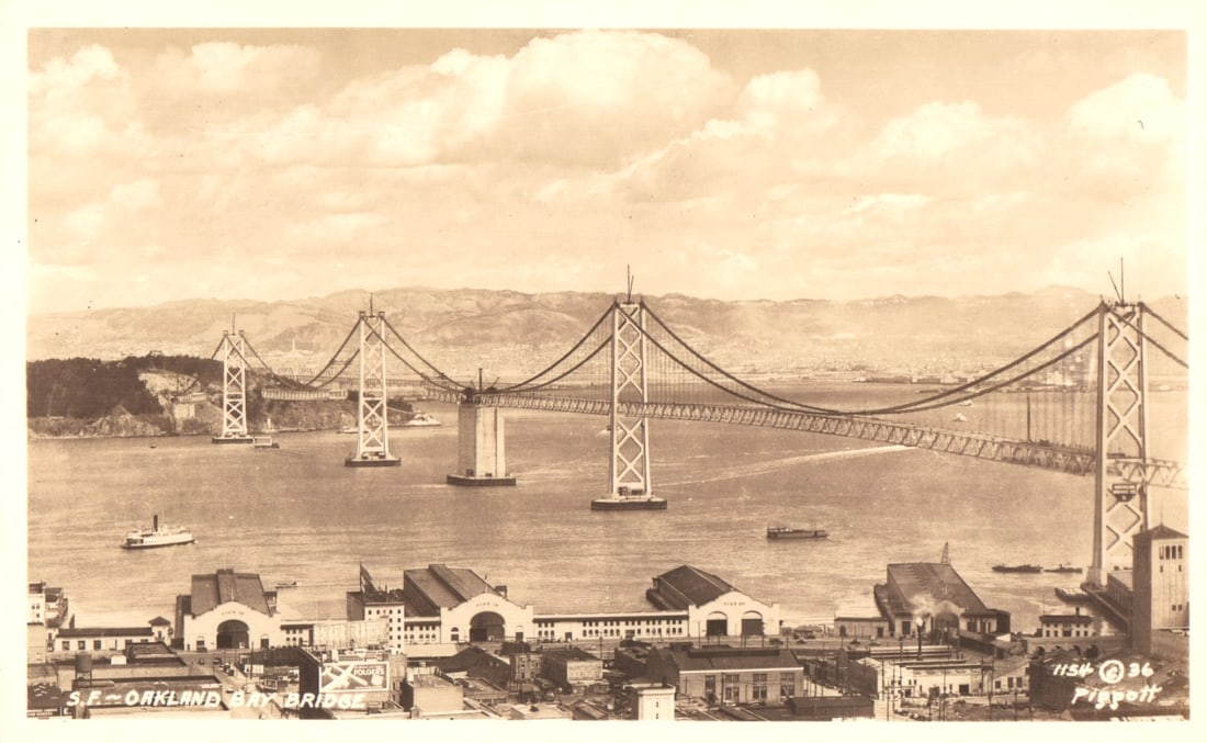 RPPC Real Photo Postcard view of the San Francisco-Oakland Bay Bridge spanning the bay, California. (1 of 2)