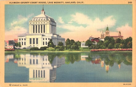 Linen postcard of the Alameda County Court House reflecting on Lake Merritt, Oakland, California c.