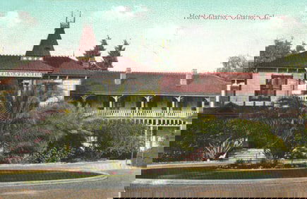 Postcard of The Hotel Ontario in Ontario, San Bernardino County, California with lush gardens c1910s