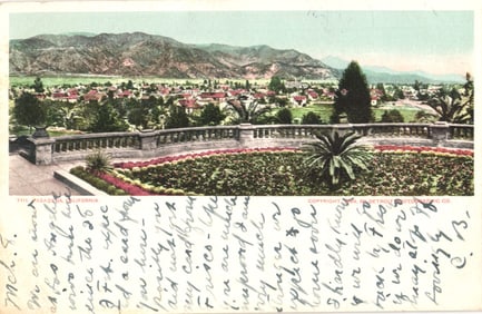 Postcard view overlooking Pasadena, California from a garden with mountains in the background, c.