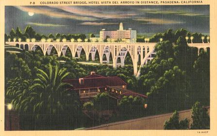 Linen postcard showing the illuminated Colorado Street Bridge at night in Pasadena, California c.