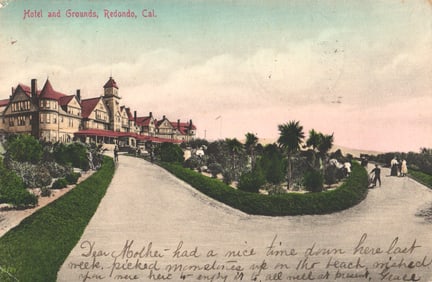 Postcard of the large Hotel and Grounds in Redondo, California, showing the driveway and gardens, c.