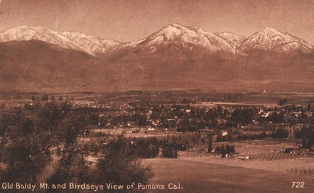 Postcard birdseye view of Pomona, California with snow-capped Old Baldy Mt. in the background c.