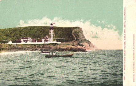 Postcard showing the Point Loma Light House near San Diego, California with a boat in the foreground