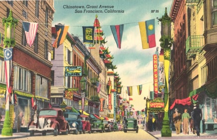 Linen postcard of Chinatown's Grant Avenue in San Francisco, California with classic cars, flags.