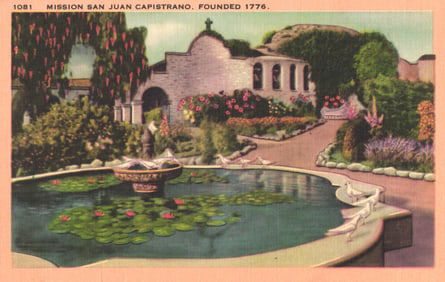 Postcard view of the Mission San Juan Capistrano's garden courtyard and lily pad pond in California.