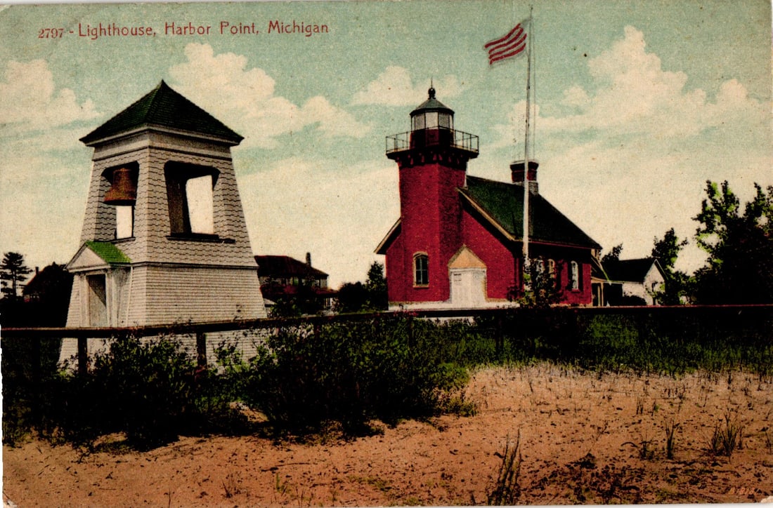 Postcard of the iconic red lighthouse and bell tower on a sandy beach in Harbor Point, Michigan: Please view photos for further description and condition considerations. Please know the scans may be darker or lighter than the actual item's true appearance. ACME Auctions offers FREE DOMESTIC SHIPP