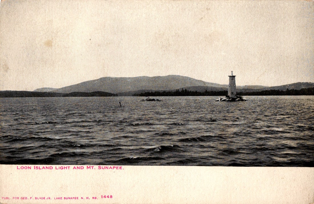 Postcard of Loon Island Light and Mt. Sunapee, a scenic view across Lake Sunapee, New Hampshire c. (1 of 2)