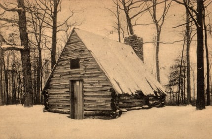 Postcard view of the Soldier's Hut at Valley Forge, Pennsylvania, a historic log cabin in winter