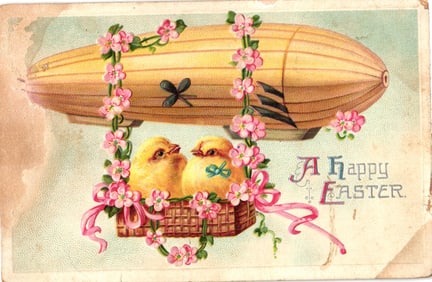 Early 1900s Easter greeting postcard with two chicks in a basket hanging from a yellow dirigible.
