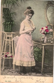 Postcard showing an Edwardian woman in her boudoir with the caption 'I wish you were here, Sis' c.