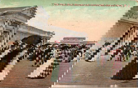 Postcard of the New Bath Houses and Boardwalk in Asbury Park, New Jersey with pedestrians, c. 1910s