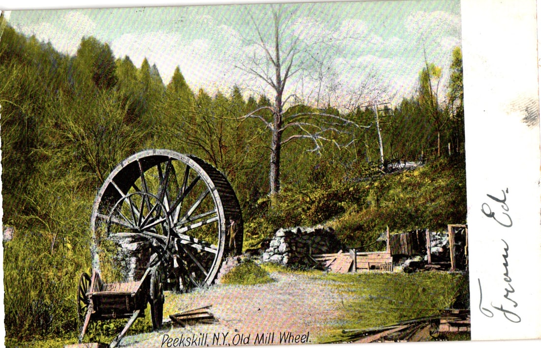 Postcard showing the Old Mill Wheel with a man nearby in a rustic Peekskill, New York scene c. 1907. (1 of 2)