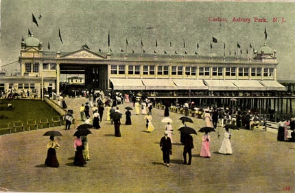 Early 1900s postcard view of the Asbury Park, New Jersey Casino and boardwalk with pedestrians.