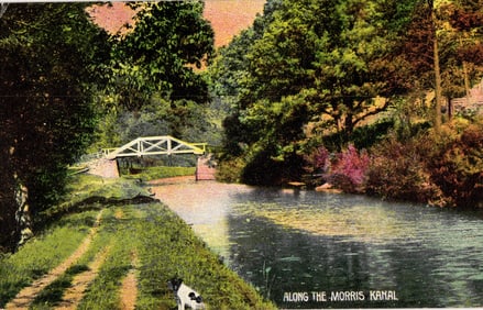 Postcard showing a scenic view along the Morris Canal in New Jersey with towpath and bridge c. 1910