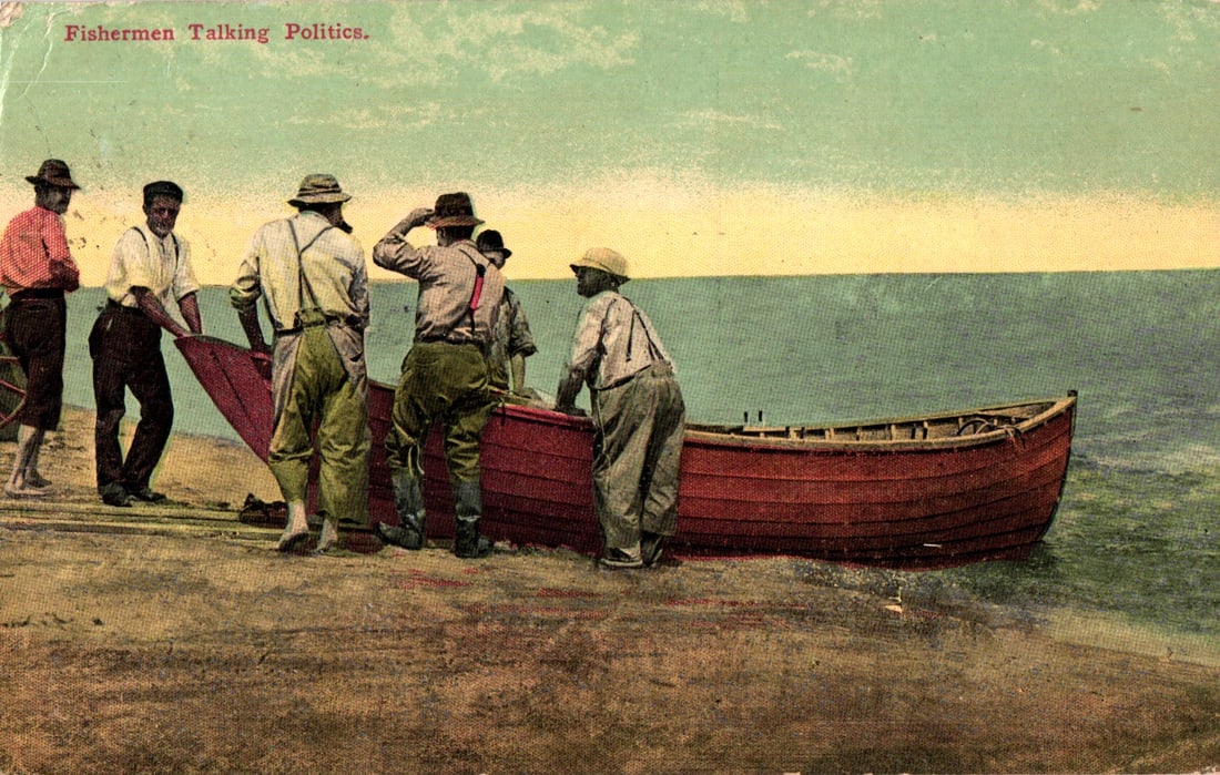 Americhrome postcard titled "Fishermen Talking Politics" showing men on a beach with a red dory (1 of 2)