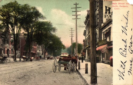 Postcard showing Main Street looking North with horse-drawn carriages in Danbury, Connecticut c.