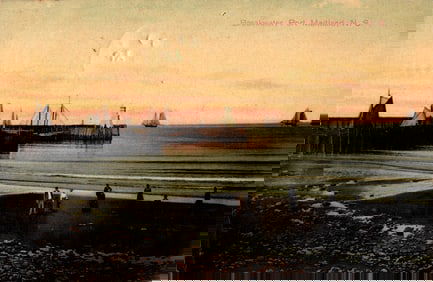 Postcard of the Breakwater at Port Maitland, Nova Scotia, Canada showing sailboats at sunset c.1909.