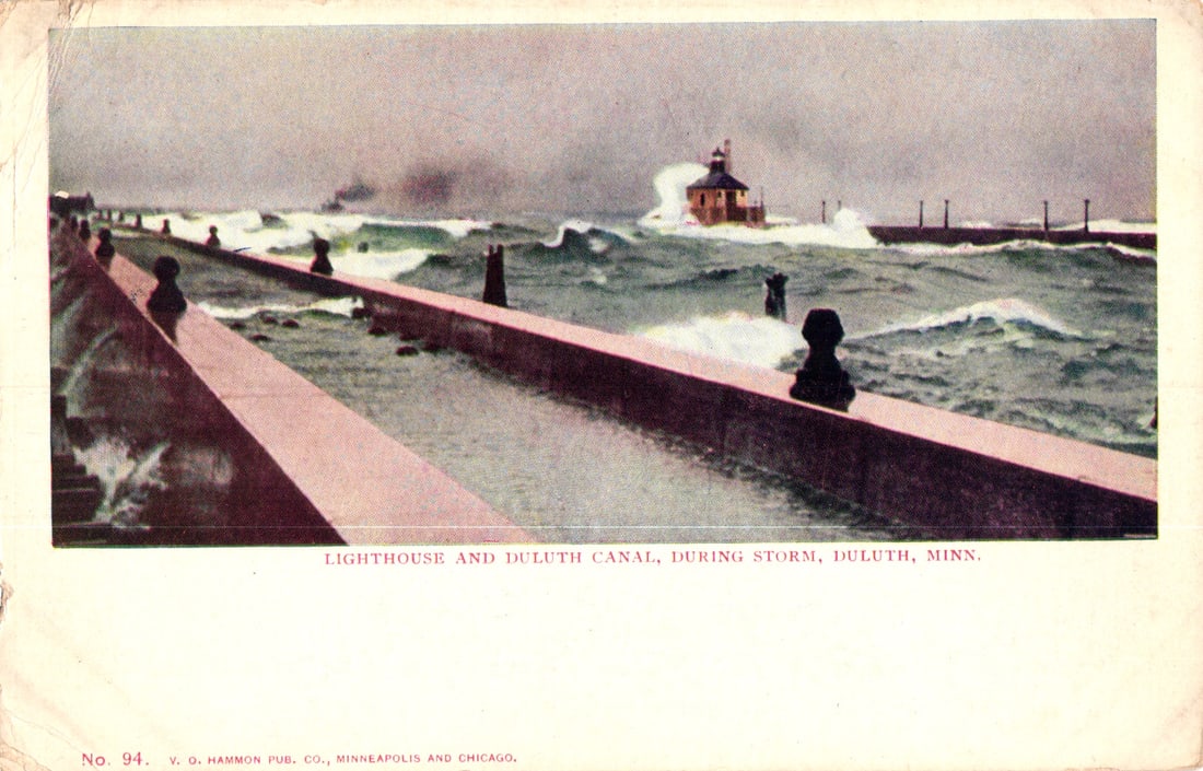 Postcard of the Lighthouse and Duluth Canal during a storm in Duluth, Minnesota, circa 1910s.: Please view photos for further description and condition considerations. Please know the scans may be darker or lighter than the actual item's true appearance. ACME Auctions offers FREE DOMESTIC SHIPP