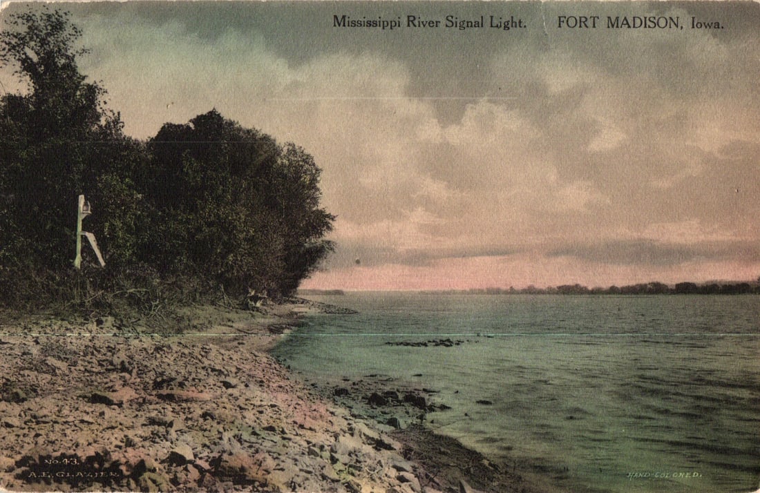 Postcard view of the Mississippi River Signal Light on the rocky shoreline in Fort Madison, Iowa: Please view photos for further description and condition considerations. Please know the scans may be darker or lighter than the actual item's true appearance. ACME Auctions offers FREE DOMESTIC SHIPP
