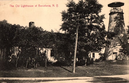 Postcard showing The Old Lighthouse at Barcelona, NY with keeper's house and trees. c. 1920s view.