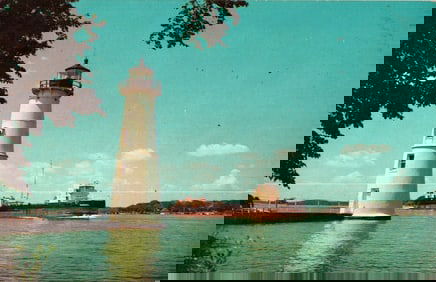 Postcard showing the Rock Island Lighthouse, freighter passing in American Channel, New York c.