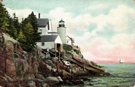 Postcard view of the iconic Bass Harbor Head Light on a rocky cliff in Mount Desert, Maine. c. 1910