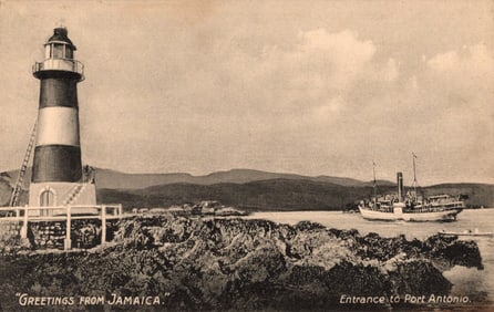 "Greetings from Jamaica" postcard showing the lighthouse at the Entrance to Port Antonio harbor.
