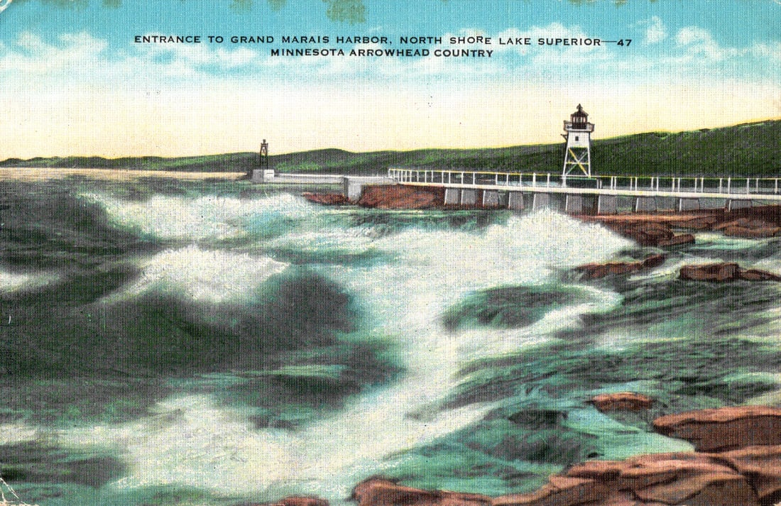 Postcard of the lighthouse at the Entrance to Grand Marais Harbor, North Shore Lake Superior,: Please view photos for further description and condition considerations. Please know the scans may be darker or lighter than the actual item's true appearance. ACME Auctions offers FREE DOMESTIC SHIPP