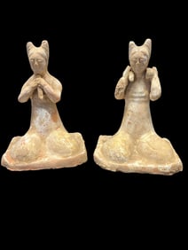 A Pair of Chinese Polychrome Pottery Figures of Kneeling Female Attendants with Horned Hairstyles