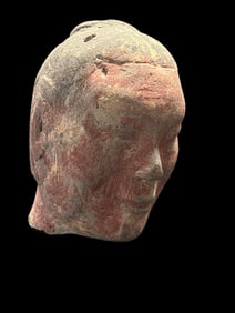 A Painted Chinese style Terracotta Head of a Figure, with Remnants of Red Pigment and a Stylized