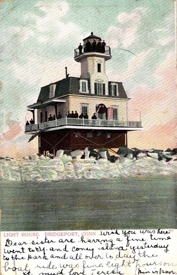 Historic Lighthouse with Observers on Balconies, Bridgeport, Connecticut, c. 1930 postcard: A prominent lighthouse structure stands in water, supported by a dark, possibly rocky base. Multiple levels include balconies where groups of individuals are observed. More people are gathered on the 