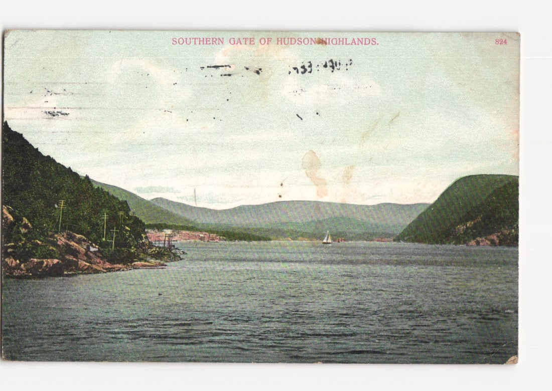 Southern Gate of Hudson Highlands, New York, scenic postcard from early 20th century: A panoramic view depicts the Southern Gate of the Hudson Highlands. A wide body of water dominates the foreground and middle ground, flanked by tree-covered hills on both sides. On the left bank, a sm