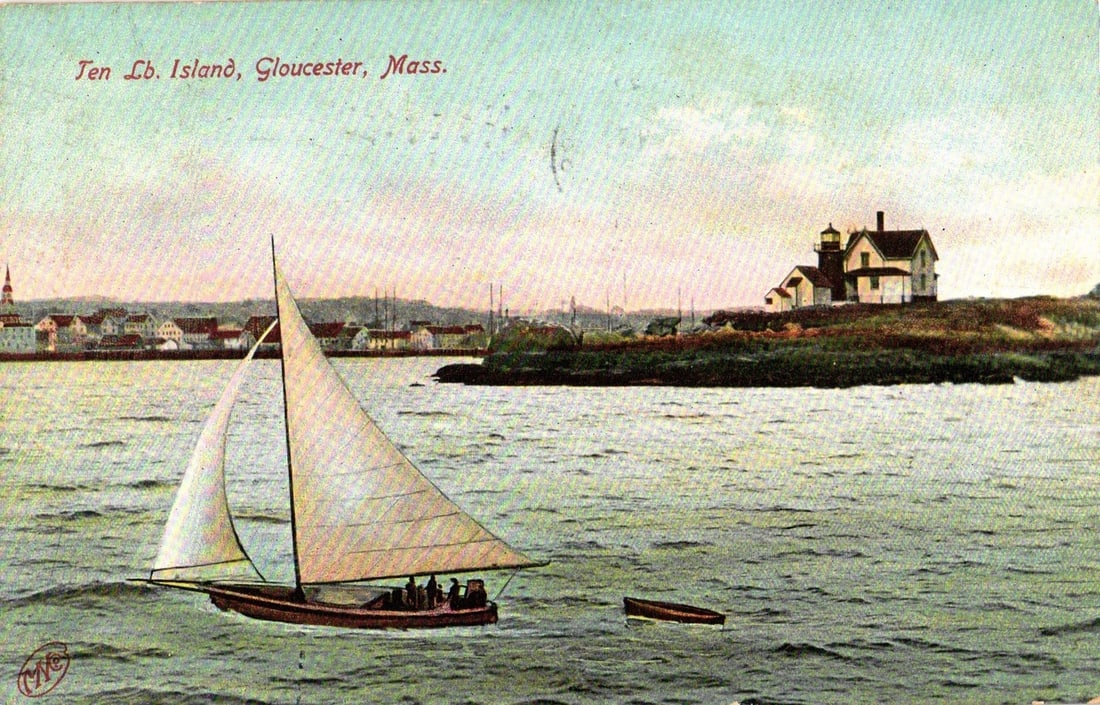 Historic Massachusetts postcard depicting Fen Lb. Island Lighthouse, Sailboat, Gloucester Bay, 1911: A chromolithograph depicting a sailboat carrying several passengers on a body of water in the foreground, with a smaller rowboat visible alongside. In the midground, a landmass features a white lighth
