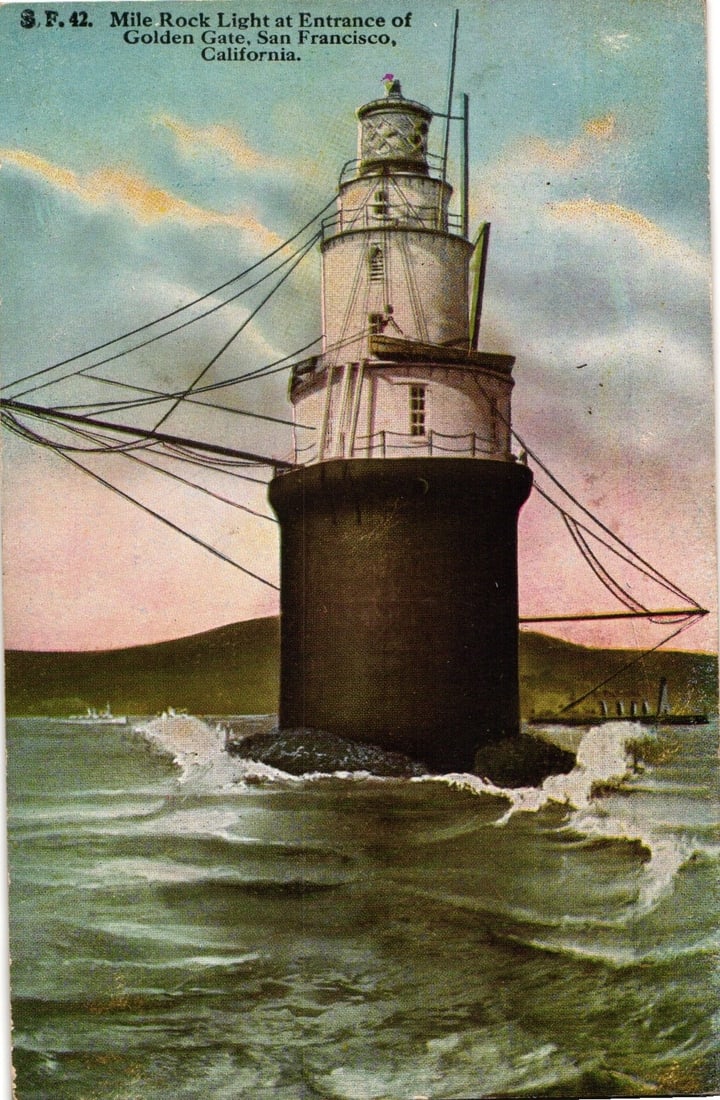 Vintage postcard of Mile Rock Lighthouse at Entrance of Golden Gate, San Francisco, California.: Mile Rock Light, a multi-tiered lighthouse structure, stands on a rocky base amidst choppy ocean waters. The lighthouse features a dark cylindrical lower section supporting a multi-story white tower w
