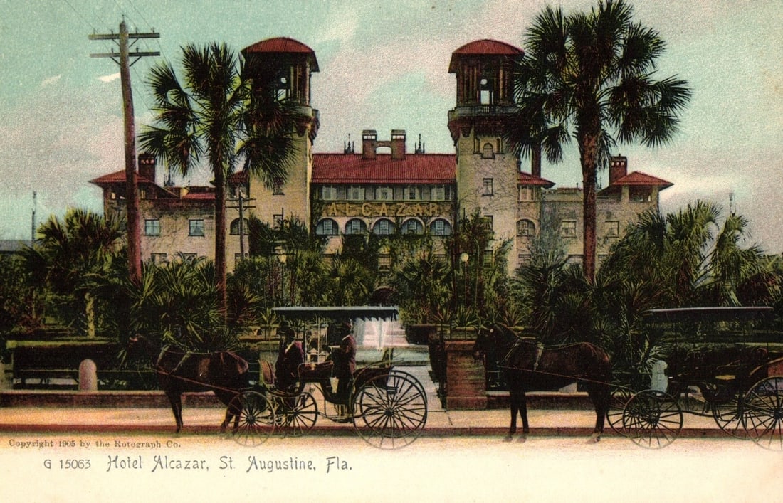 Historic Hotel Alcazar with Horse-Drawn Carriages, St. Augustine, Florida, 1905 postcard: The Hotel Alcazar, a large Spanish Revival style building with a red tile roof and two prominent octagonal towers, stands prominently. The name "ALCAZAR" is visible on the building's facade. Lush palm