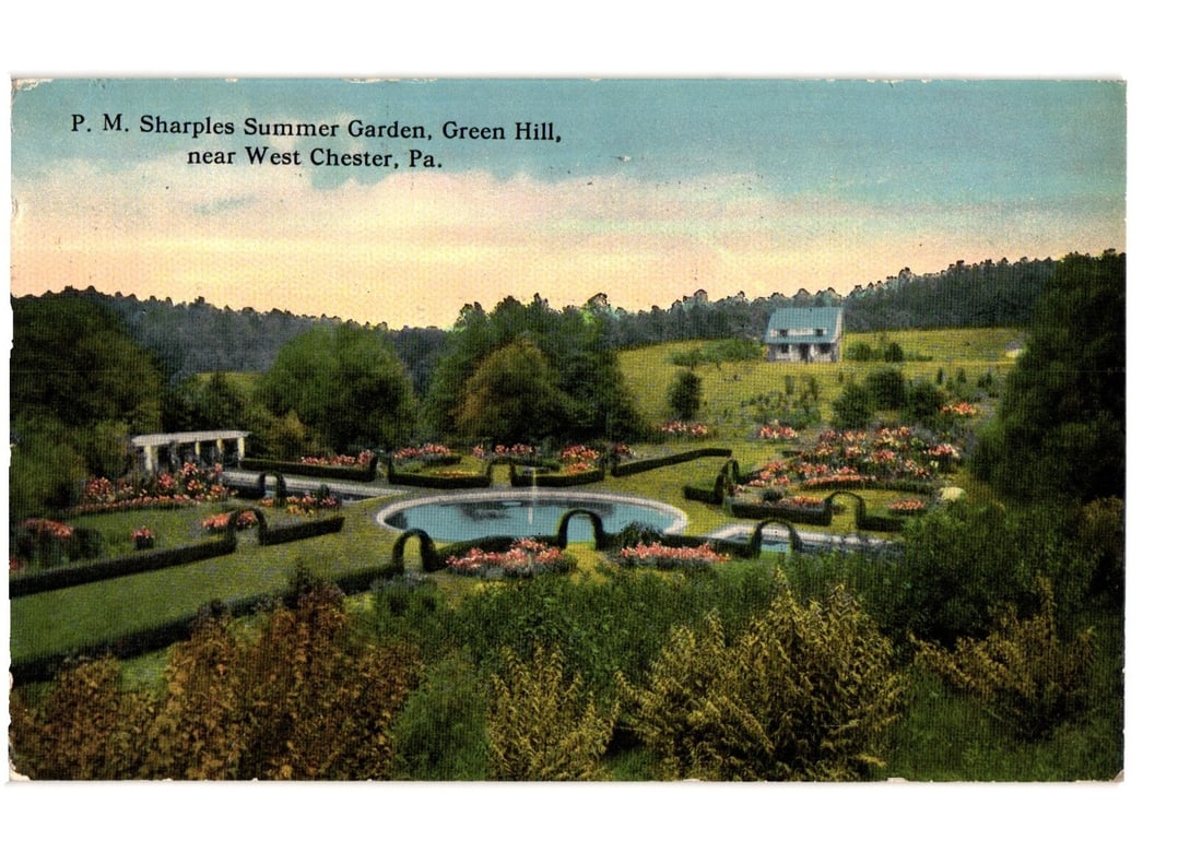 P. M. Sharples Summer Garden, Green Hill near West Chester, Pennsylvania postcard, c. 1910s: A scenic view of P. M. Sharples Summer Garden, featuring a formal landscape design. The central focus is a large, oval-shaped pond with a fountain, surrounded by manicured hedges and vibrant flower be
