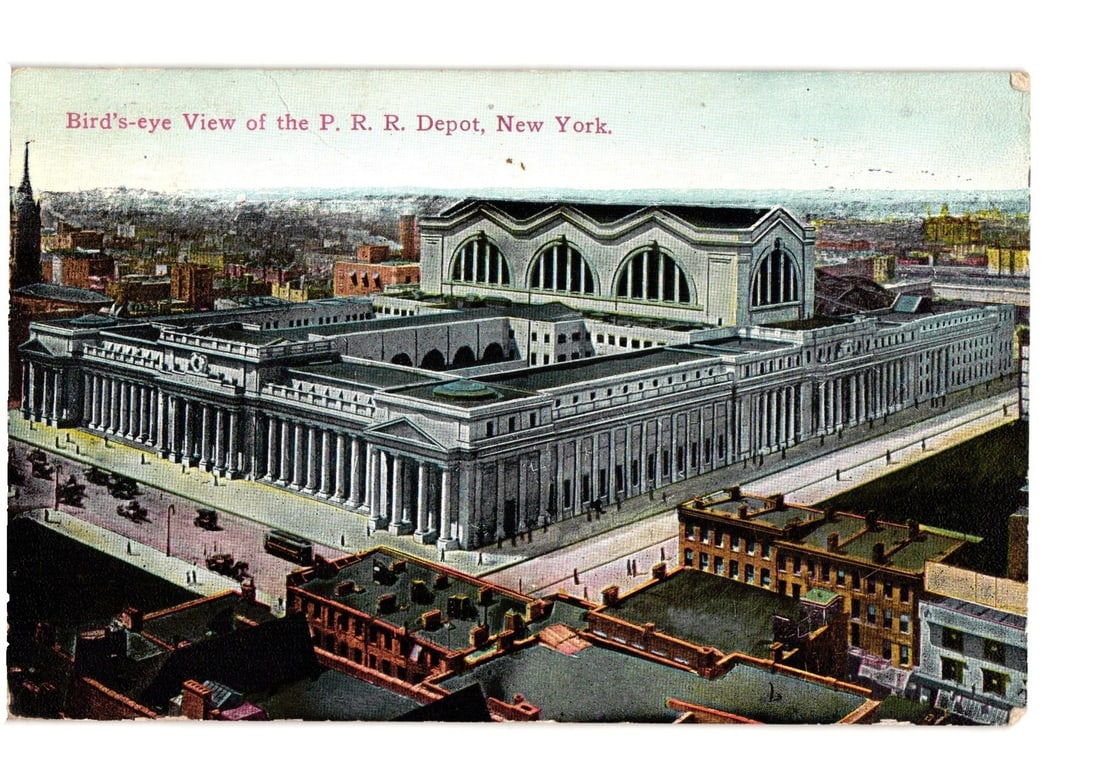 Bird's-eye View of the P. R. R. Depot, New York City, 1912 Era Vintage Lithograph postcard: A grand neoclassical building, the Pennsylvania Railroad Depot, is depicted in a bird's-eye view, showcasing its extensive facade with numerous columns and large arched windows. Early model automobile