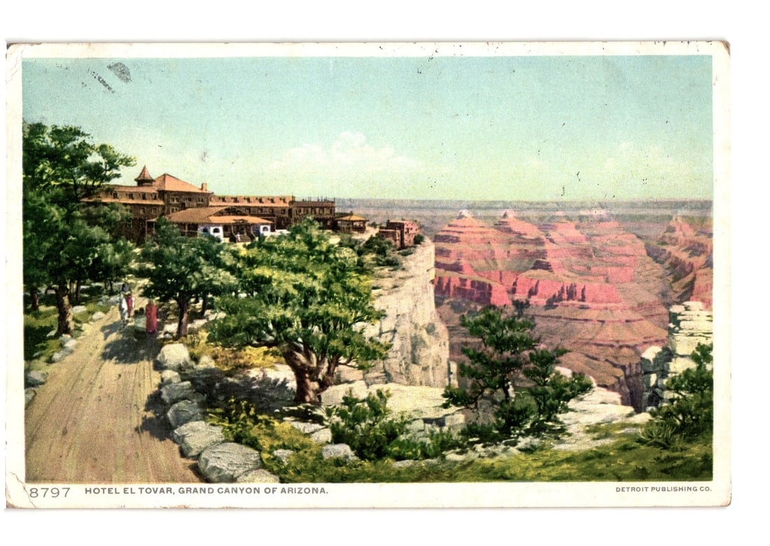 Hotel El Tovar on the rim of Grand Canyon, Arizona, historic landscape postcard, 1912.: A panoramic view depicts the El Tovar Hotel situated on the rim of the Grand Canyon, Arizona. The multi-story hotel with its distinctive roofline is visible on the left, nestled among numerous green t